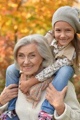  grandmother and granddaughter in park