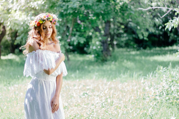 Obraz na płótnie Canvas Wedding background. Bride in wedding dress with flower wreath on hairs.