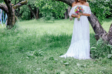 Obraz na płótnie Canvas Bride with beautiful white wedding dress as wedding background. Place for your text.