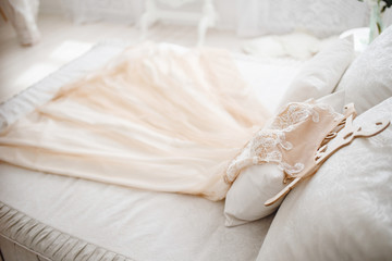 Fototapeta na wymiar Wedding Dress. The bride's dress rests on the bed