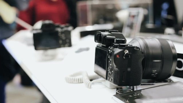 Photo-camera on the shelves in shopping centers