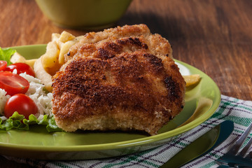 Cutlet Cordon Bleu with pork loin served with French fries and salad