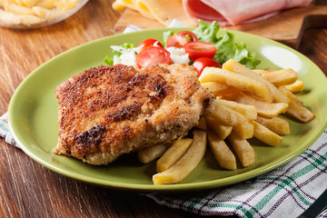Cutlet Cordon Bleu with pork loin served with French fries and salad