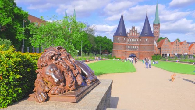 People walking near Holsten Gate in Luebeck, Germany.
