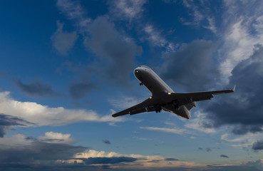 Airplane flying in sky with beautiful clouds
