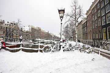 Fototapeta premium Snowy Amsterdam in the Netherlands