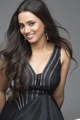 Naklejka premium Portrait of Glamourous Indian woman wearing black dress