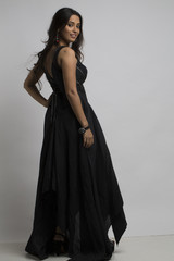 Young Indian woman wearing black posing indoor studio lighting
