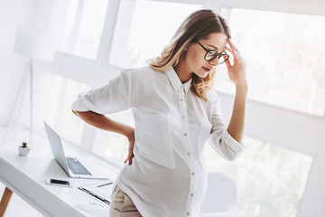 Pregnant woman working