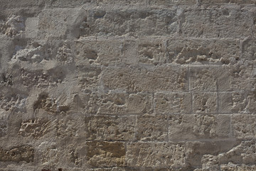 battered concrete sand stone wall