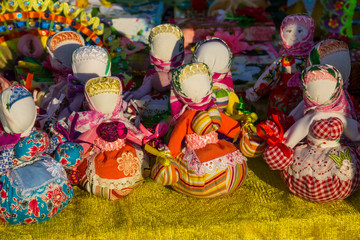 Dolls toys handmade souvenirs at the exhibition of folk arts
