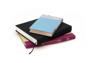 Stack of books on white background