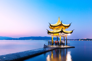 beautiful scene of lake with pavilion at twilight