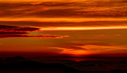 Fototapeta na wymiar Sunrise landscape over the Adams peak aka Sri-Pada in Sri-Lanka