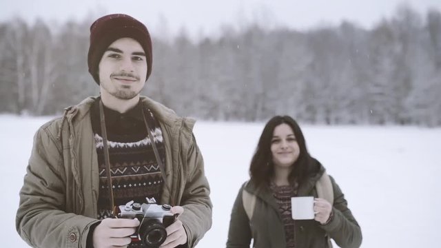 Teenage boy and girl in winter nature.
