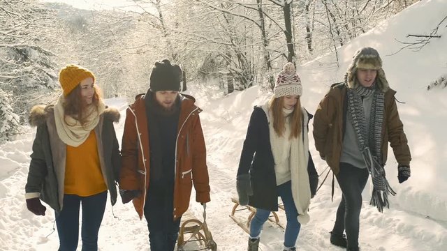 Teenagers on a walk in winter nature.