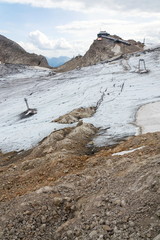 People hiking around Dachstein Hunerkogel mountain station, Alps, Austria