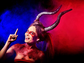 Mad satan woman on black magic ritual of in hell . Witch reincarnation mythical creature on Sabbath. Devil absorbing soul on Halloween. Mythical zodiac Horoscope Capricorn Aries. Astral travel.