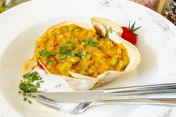 Soybean stew with vegetables and parsley.