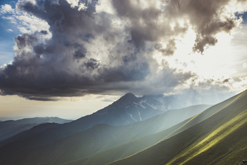 Sunset over green mountains. Landscape from the Tian Shan mountains of Kyrgyzstan. © skinfaxi