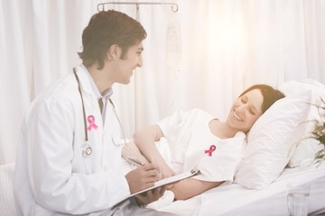 Fototapeta premium Composite image of breast cancer awareness ribbon