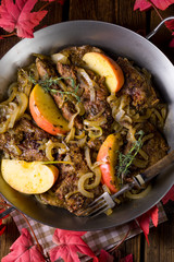 Fried liver with onion apple and herbs.