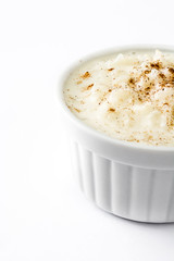 Arroz con leche. Rice pudding with cinnamon isolated on white background
