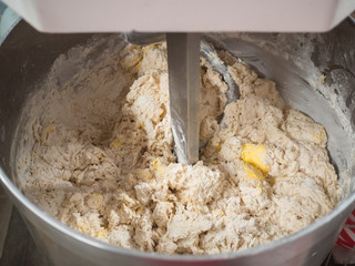 Bread process by using flour mixing machine in factory,.Mixing between flour Butter and water cause clotting