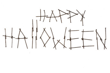 happy Halloween inscription with nails on a white background isolate
