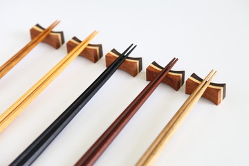 Beautiful collection of wooden chopsticks isolated on white background