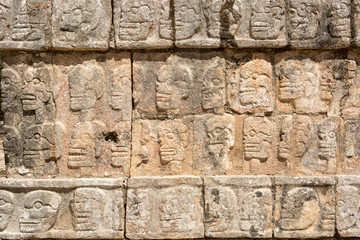 bas-relief of sculpted skulls at Chichen Itza archaeological site in Yucatan, Mexico
