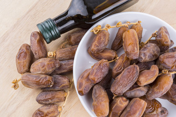 Close up concept of dried Dates and Dates concentrate on isolated white background.