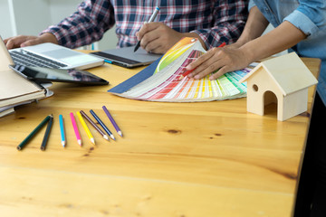 Team work for graphic design working on wood table with computer
