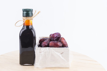 Close up concept of dried Dates and Dates concentrate on isolated white background.