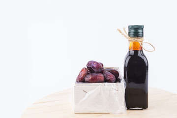 Close up concept of dried Dates and Dates concentrate on isolated white background.