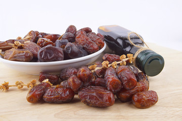 Close up concept of dried Dates and Dates concentrate on isolated white background.