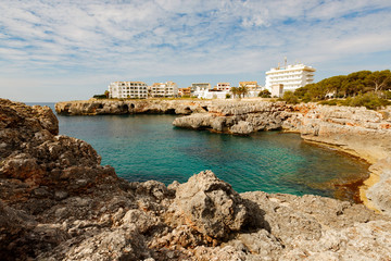 Fototapeta na wymiar Rocky coast and blue lagoon on the island of Mallorca, Spain