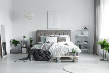 Many pillows on a bed