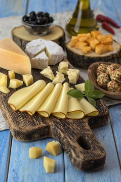 Cheese on a wooden table. 