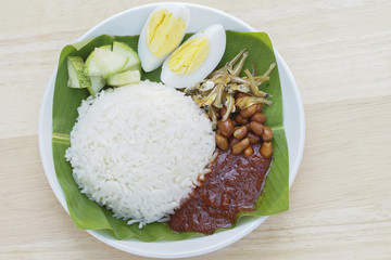 Original Nasik Lemak traditional malaysian food on served outdoors, Banana leaf