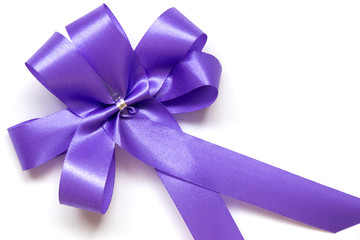 Blue bow as award ribbon on white background