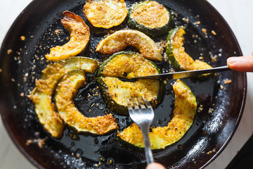 zucchini in a cast-iron frying pan on the fork