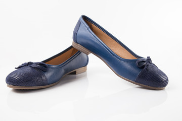 Female blue leather shoe on white background, isolated product, comfortable footwear.