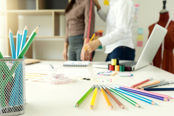 fashion designer work in the studio with graphic and tailor tool