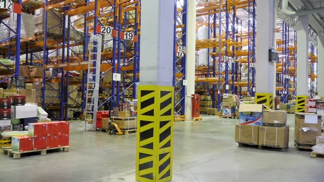 Timelapse of a working warehouse during the day.