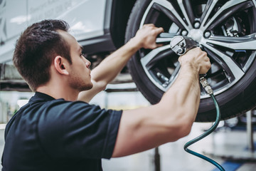 Handsome auto service mechanic