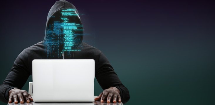 Composite image of male hacker using laptop on table - Powered by Adobe
