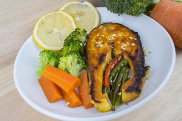 Grilled Salmon with fresh salad and lemon. Selective focus