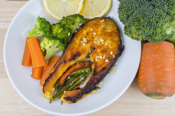 Grilled Salmon with fresh salad and lemon. Selective focus