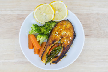Grilled Salmon with fresh salad and lemon. Selective focus
